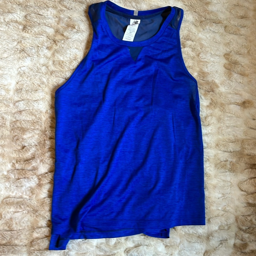Never worn, no tags, runs large
